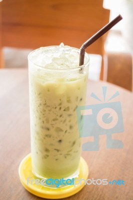 Glass Of Iced Green Tea Latte Stock Photo