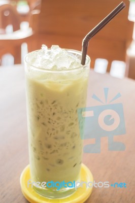 Glass Of Iced Green Tea Latte Stock Photo