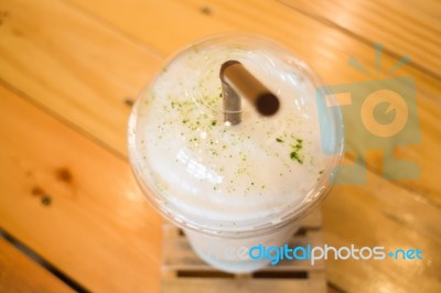 Glass Of Iced Milk Green Tea Stock Photo