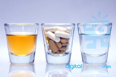 Glass Of Medicine And Water Stock Photo