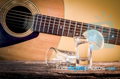 Glass Of Vodka And Classical Guitar Stock Photo