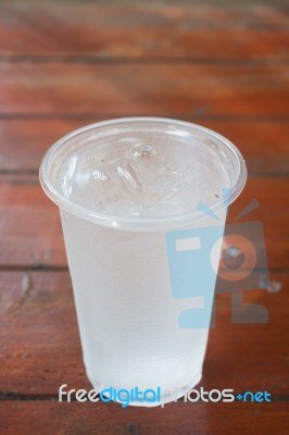 Glass Of Water On Wooden Table Stock Photo