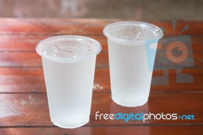 Glass Of Water On Wooden Table Stock Photo