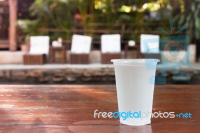 Glass Of Water On Wooden Table Stock Photo