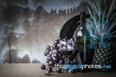 Glass Of Wine And Fruits On Withe Of Vintage Stock Photo