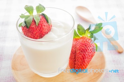 Glass Of Yogurt With Fresh Strawberry Stock Photo