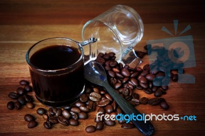 Glass Shot Of Fresh Coffee On Wood Table Stock Photo