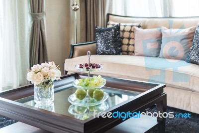 Glass Vase Of Flower On Wooden Table In Living Room Stock Photo