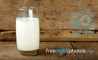 Glass With Milk On The Wooden Background Stock Photo