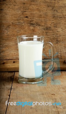 Glass With Milk On The Wooden Background Stock Photo