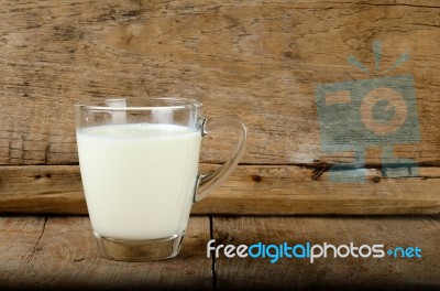 Glass With Milk On The Wooden Background Stock Photo