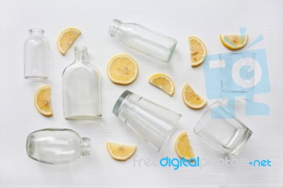 Glasses And Bottle For Drinks With Lemon Slices. Healthy Vitamin… Stock Photo