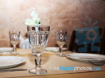 Glasses And Plates On Table Stock Photo