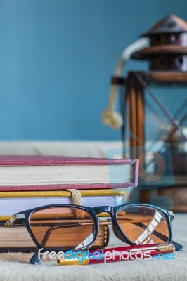 Glasses And Supplies On Desk Stock Photo