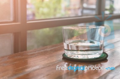 Glasses Of Water On A Wooden Table. Selective Focus. Shallow Dof… Stock Photo