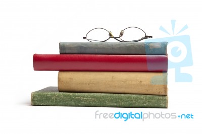 Glasses on Old Books Stock Photo