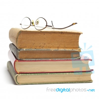 Glasses on Old Books Stock Photo