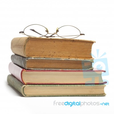 Glasses on Old Books Stock Photo