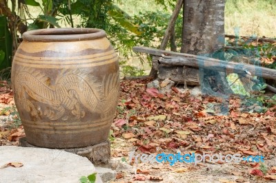 Glazed Water Jar With Dragon Pattern Stock Photo