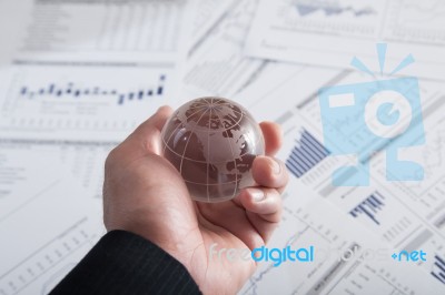 Globe With Chart Papers Stock Photo