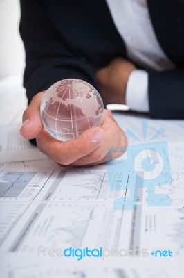 Globe With Chart Papers Stock Photo