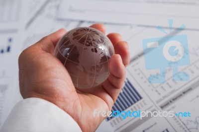 Globe With Chart Papers Stock Photo