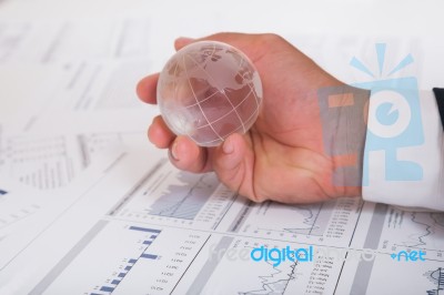 Globe With Chart Papers Stock Photo