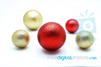 Gold And Red Ball Ornament On White Background Stock Photo