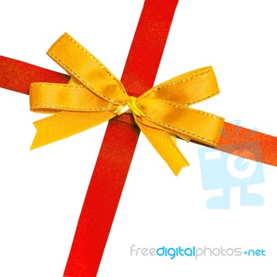 Gold Bow On Red Ribbon Stock Photo