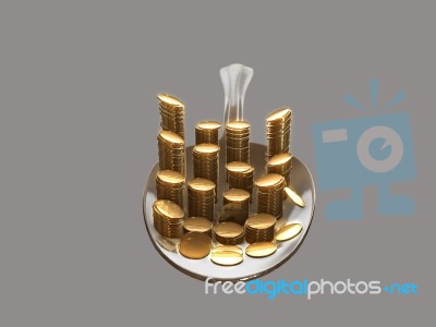 Gold Coins On A Silver Spoon Stock Image