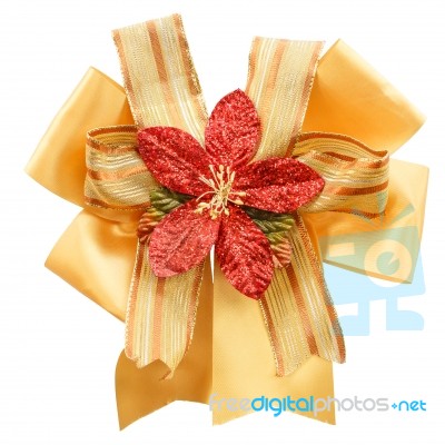 Gold Color Bow With Artificial Flower Stock Photo