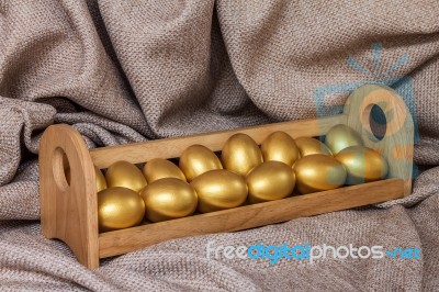 Gold Easter Egg  In Wooden Shelf Stock Photo