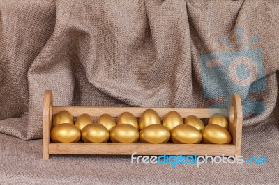 Gold Easter Egg  In Wooden Shelf Stock Photo