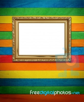 Gold Picture Frame On Colorful Wood Stock Photo