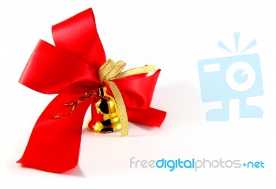 Golden Bell With Red Satin Bow Stock Image