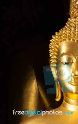 Golden Buddhist Statue Face Stock Photo