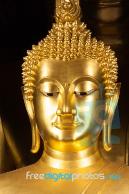 Golden Buddhist Statue Face Stock Photo