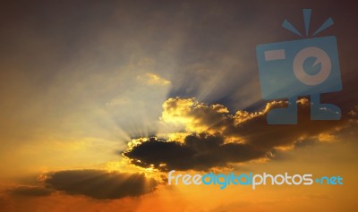 Golden Color Of  Beautiful Dramatic Dusky Sky In Evening Show Ra… Stock Photo