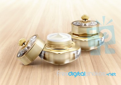 Golden Crown Cosmetic Jar On Wood Background Stock Photo