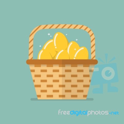 Golden Eggs In Wicker Basket Stock Image