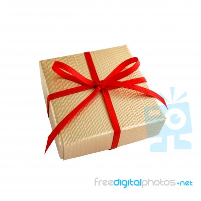 Golden Gift Box With Red Ribbon Stock Photo