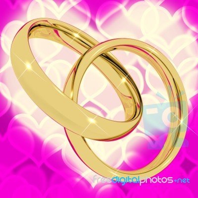 Golden Rings On Pink Heart Stock Image