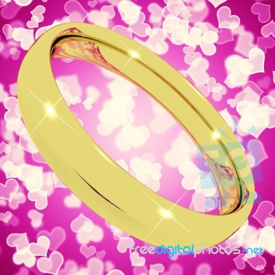 Golden wedding Ring On Pink Heart Stock Image