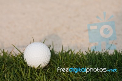 Golf Ball And Sand Bunker Stock Photo