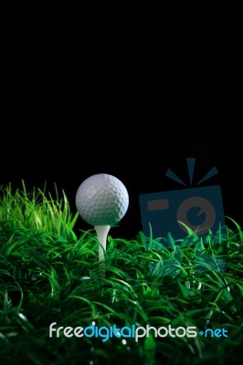 Golf Ball On Green Grass With Black Background Stock Photo