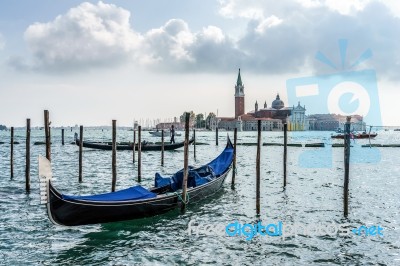 Gondola Moored At The Entrance To The Grand Canal Stock Photo