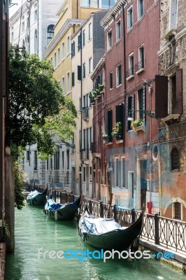 Gondolas Moored Along A Canal In Venice Stock Photo