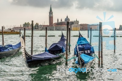 Gondolas Moored At The Entrance To The Grand Canal Stock Photo