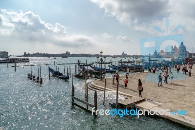 Gondolas Moored At The Entrance To The Grand Canal Stock Photo