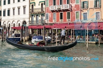 Gondolier In Venice Stock Photo